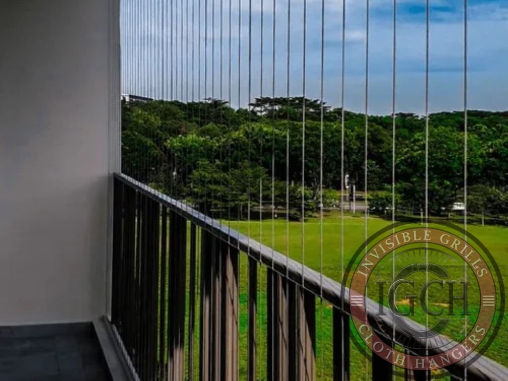 Apartment balcony secured with invisible grills without blocking outside view in Nallagandla