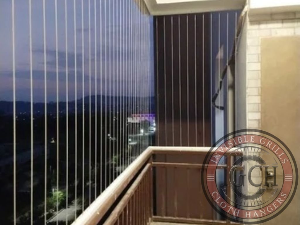 Transparent invisible grills keeping pigeons away from balcony space in Shamshabad