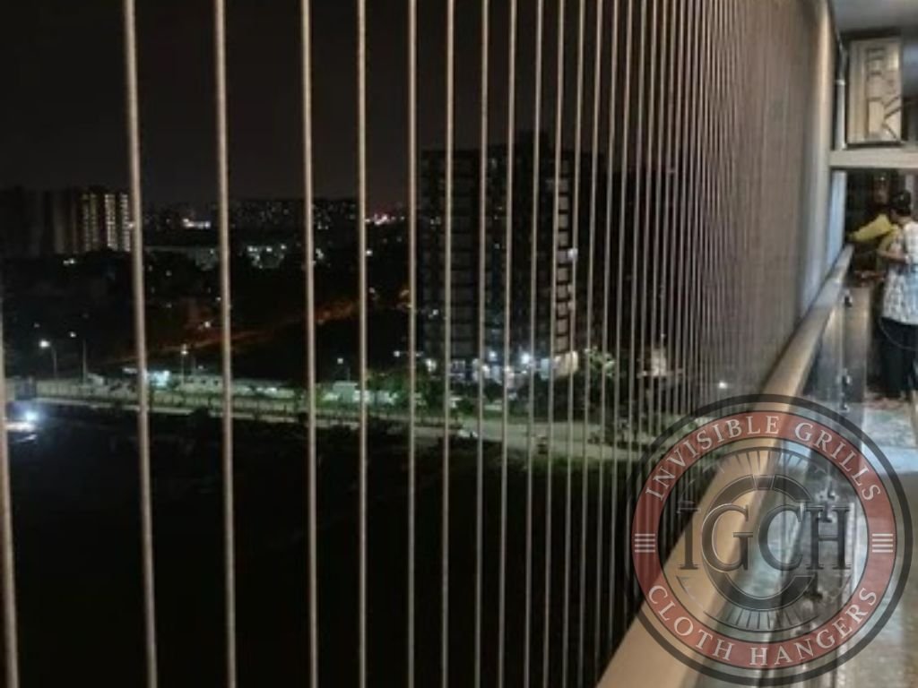 Strong stainless steel invisible grills providing secure balcony protection in Adyar