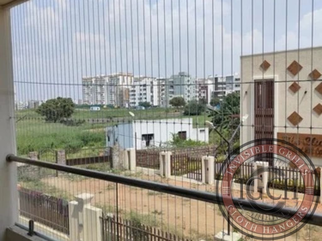 Apartment balcony fitted with stainless steel invisible grills for security in Nizamabad